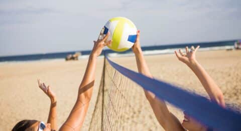 Beach vol­ley­ball in sum­mer vacation